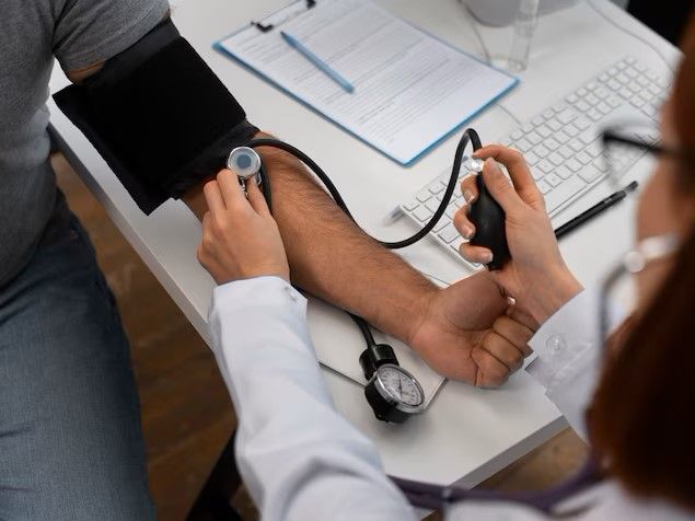 high-angle-doctor-checking-patient_23-2150165435.jpg